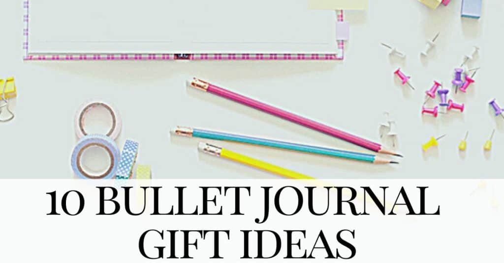 bullet journal gift ideas pink bullet journal and accessories on a white background