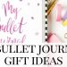 bullet journal gift ideas pink bullet journal and accessories on a white background