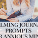 woman sits writing in journal using calming journal prompts