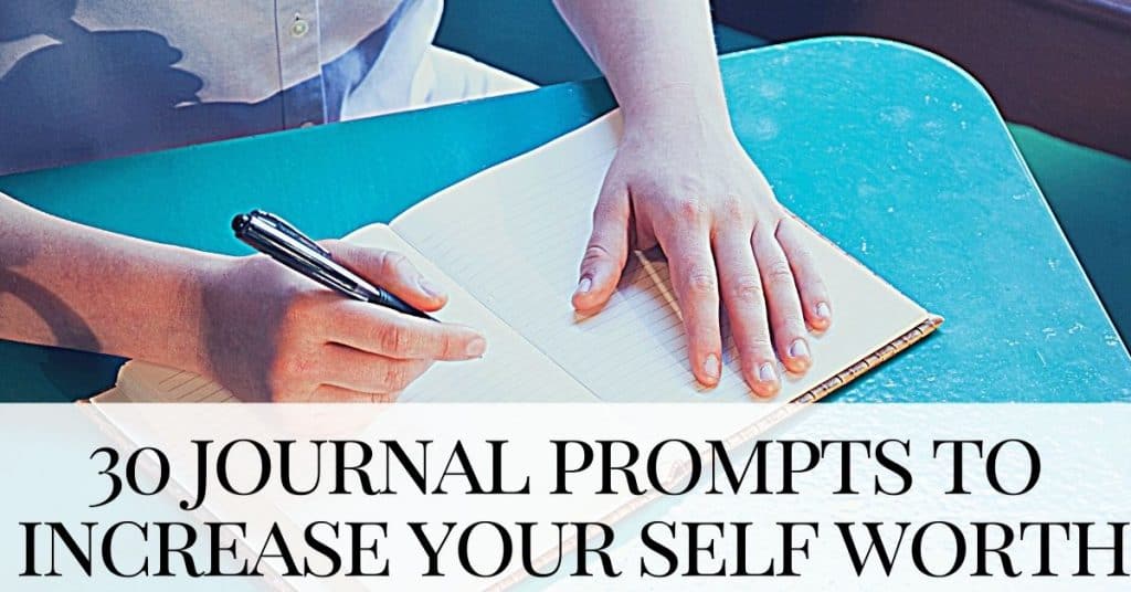 man sits at table writing journal prompts for self worth