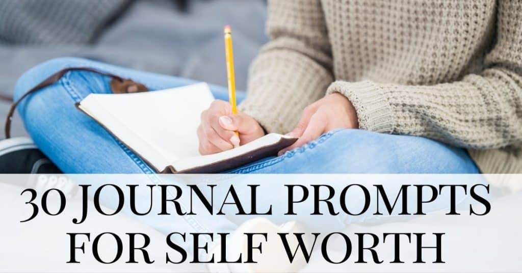 woman sits with legs crossed writing journal prompts for self worth