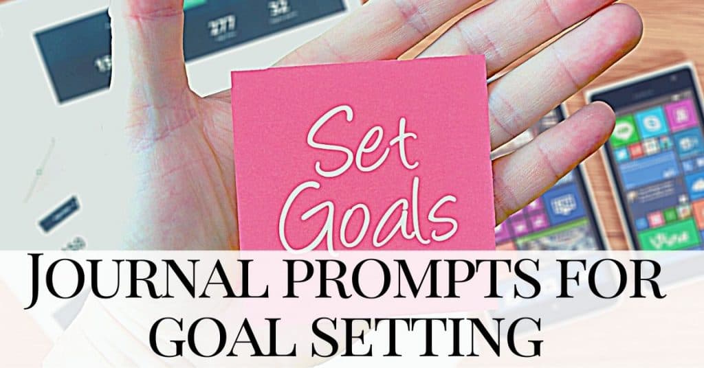 a hand holding a piece of paper with set goals written on it - Journal prompts for goalsetting, goal setting journal prompts, goal setting prompts
