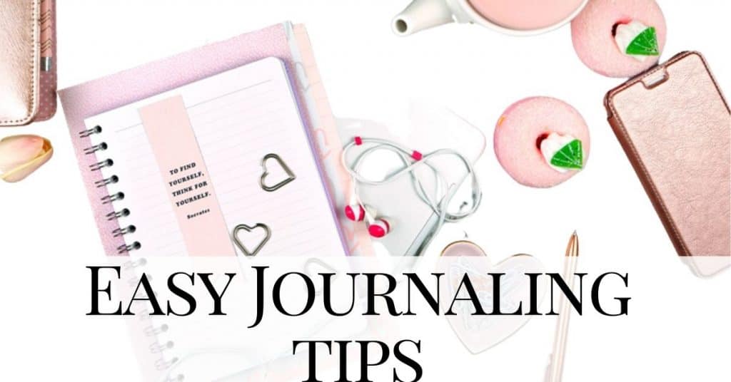 pink journal next to a bunch of flowers - easy journaling