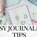 pink journal next to a bunch of flowers - easy journaling