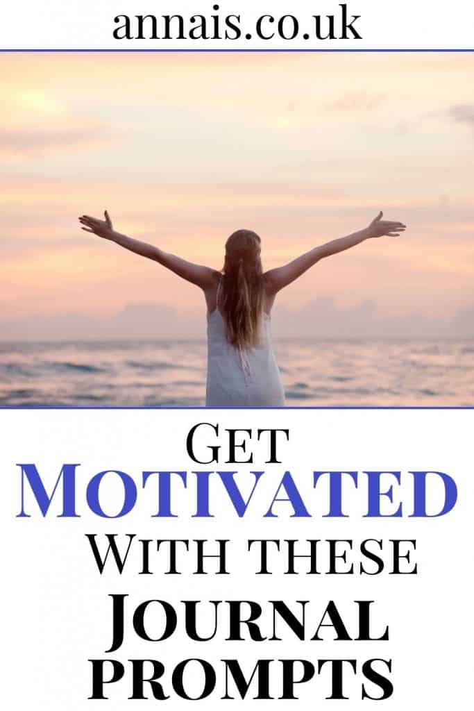 motivation journal prompts - woman stands with her arms out looking at the sunset